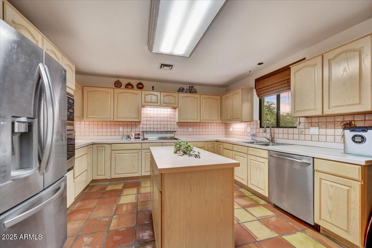 39258 North Ridgeway Drive Cave Creek, AZ 85331 - Photo 21 of 51 a kitchen with stainless steel appliances granite countertop a sink stove and cabinets