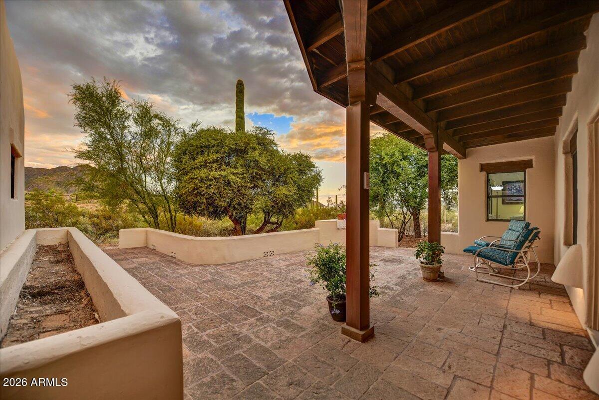 39258 North Ridgeway Drive Cave Creek, AZ 85331 - Photo 4 of 51 a view of a porch with furniture and floor to ceiling window