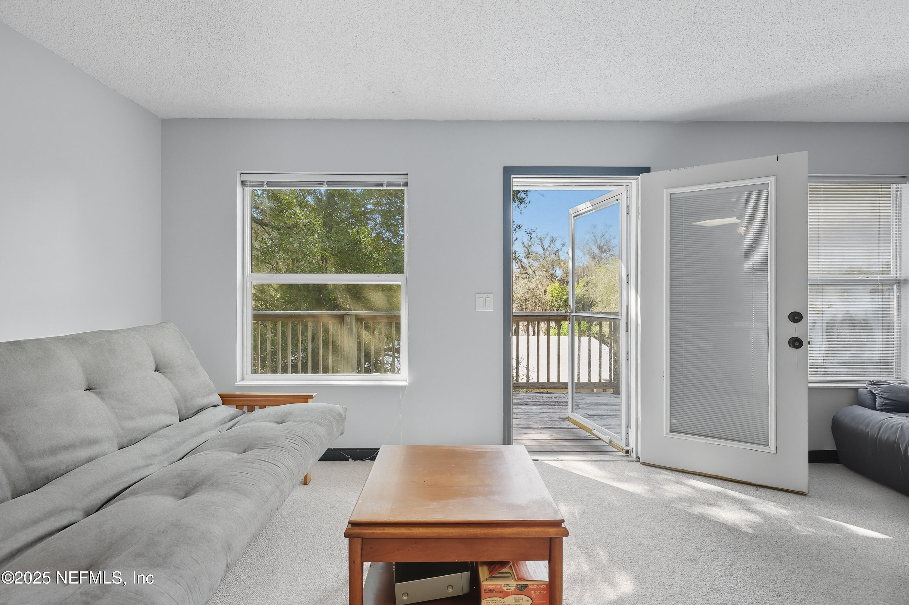 6470 Brooklyn Bay Road Keystone Heights, FL 32656 - Photo 30 of 56 a living room with furniture and a window