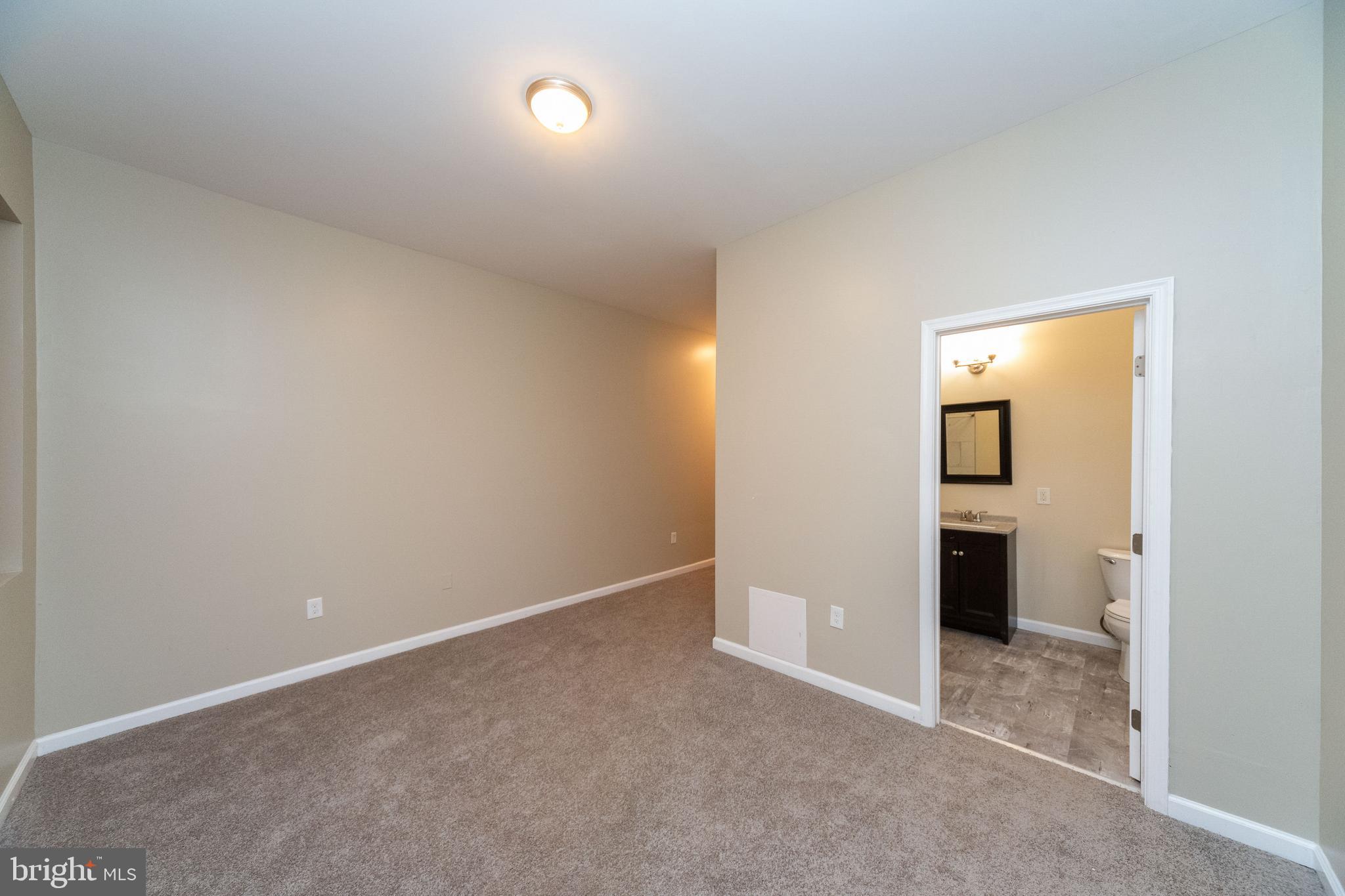 1708 Madison Avenue Baltimore, MD 21217 - Photo 16 of 56 an empty room with closet and a bathroom