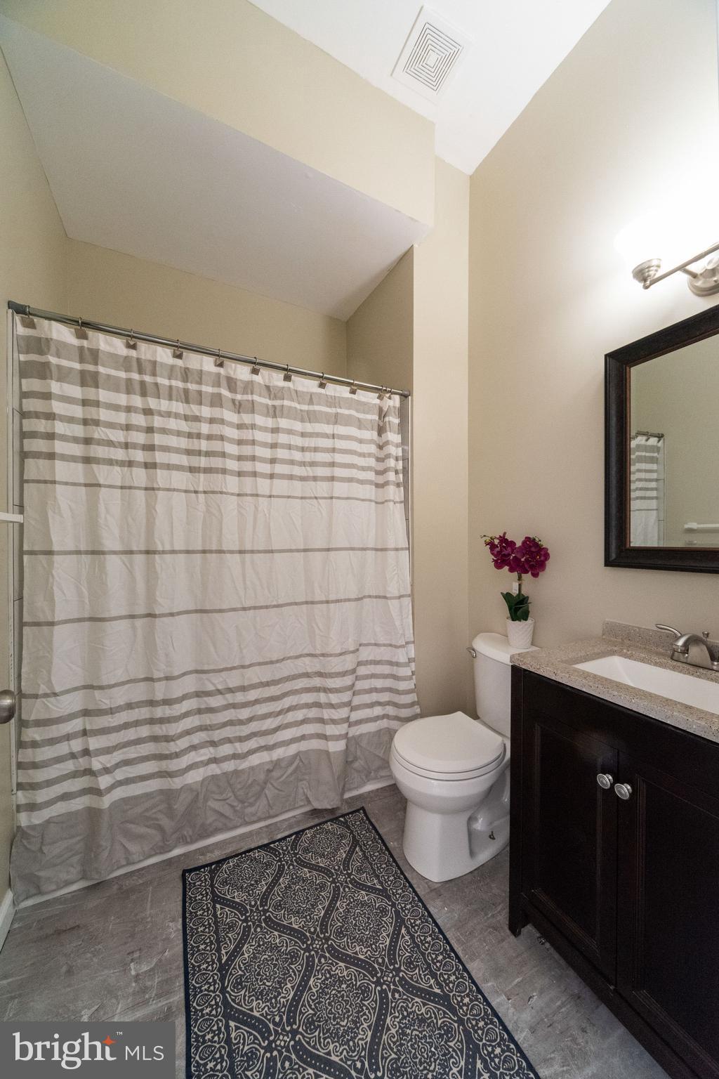 1708 Madison Avenue Baltimore, MD 21217 - Photo 26 of 56 a bathroom with a toilet and a sink