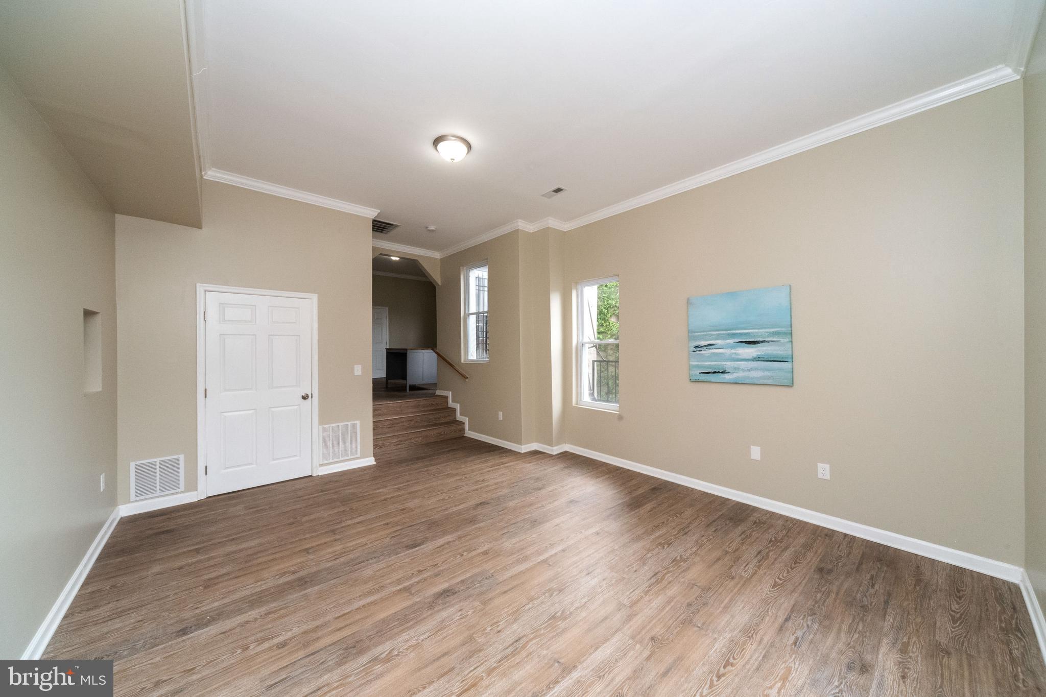 1708 Madison Avenue Baltimore, MD 21217 - Photo 28 of 56 a view of an empty room with wooden floor