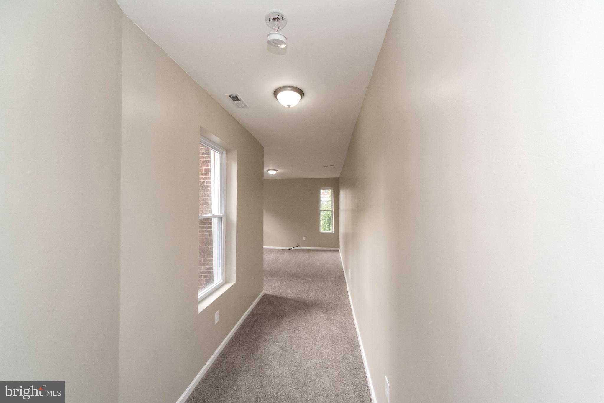 1708 Madison Avenue Baltimore, MD 21217 - Photo 29 of 56 a view of hallway with windows
