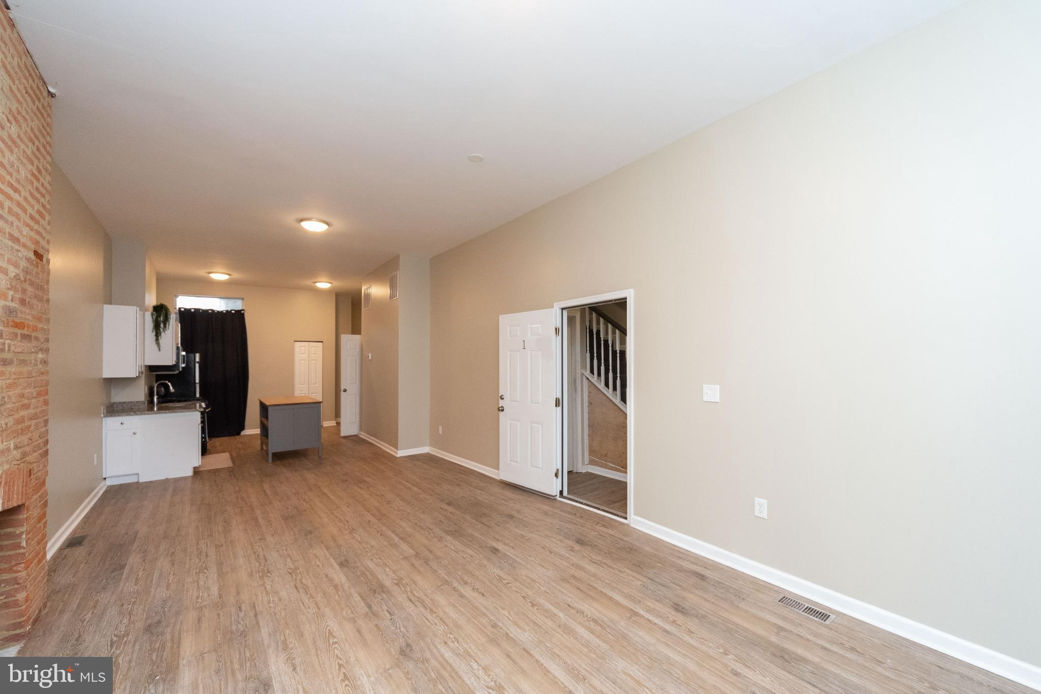 1708 Madison Avenue Baltimore, MD 21217 - Photo 3 of 56 a view of an empty room with kitchen