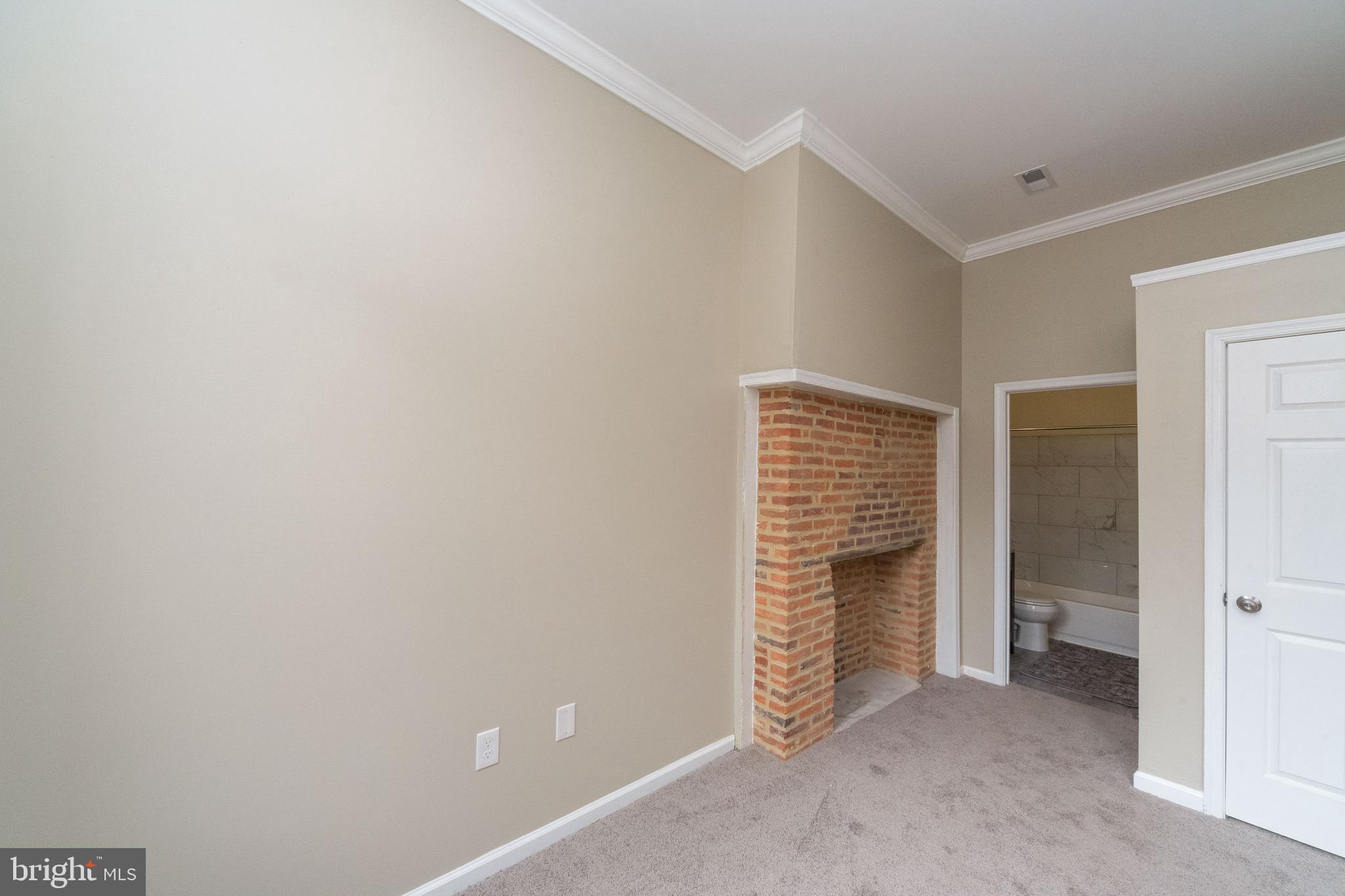 1708 Madison Avenue Baltimore, MD 21217 - Photo 37 of 56 a view of an empty room with stairs