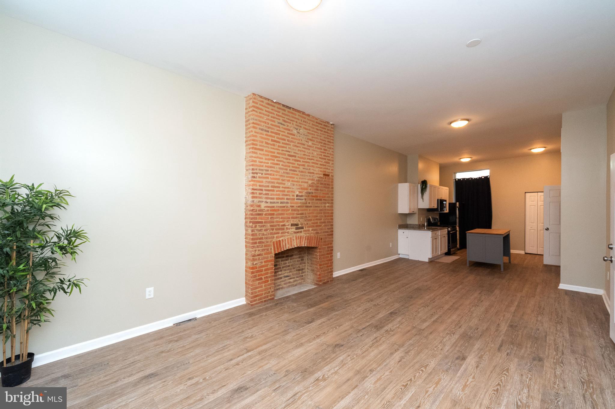1708 Madison Avenue Baltimore, MD 21217 - Photo 4 of 56 a view of a livingroom with a furniture and a potted plant