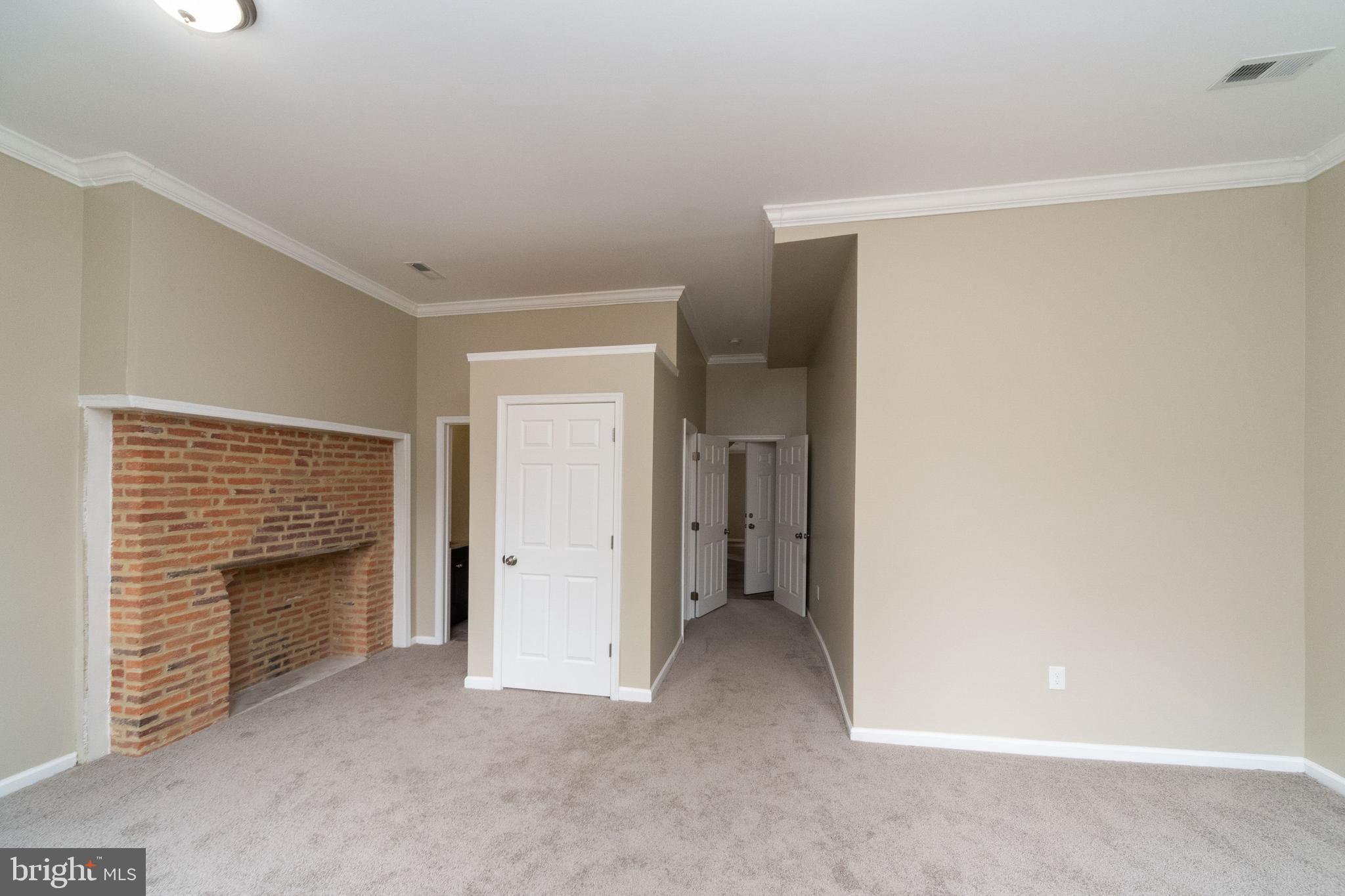 1708 Madison Avenue Baltimore, MD 21217 - Photo 41 of 56 a view of an empty room with closet and a fireplace