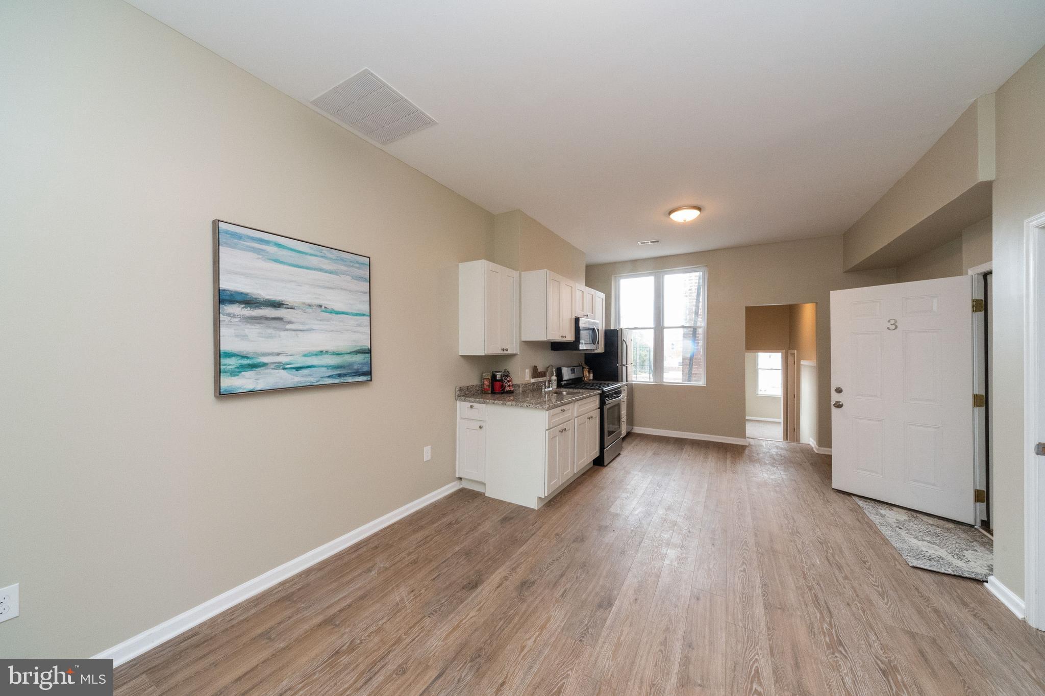 1708 Madison Avenue Baltimore, MD 21217 - Photo 42 of 56 a view of kitchen with wooden floor and electronic appliances