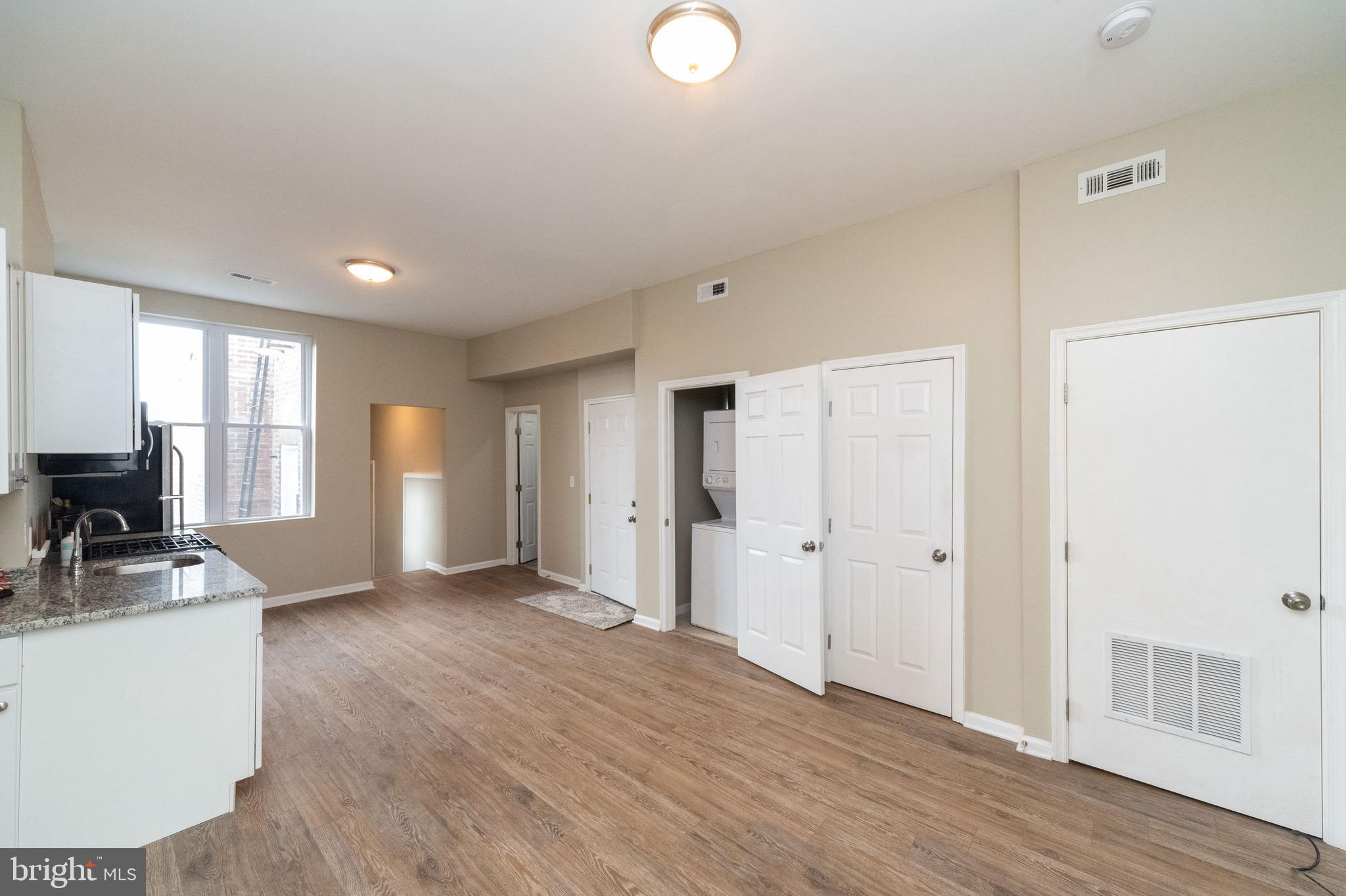 1708 Madison Avenue Baltimore, MD 21217 - Photo 44 of 56 a view of a kitchen cabinets and wooden floor