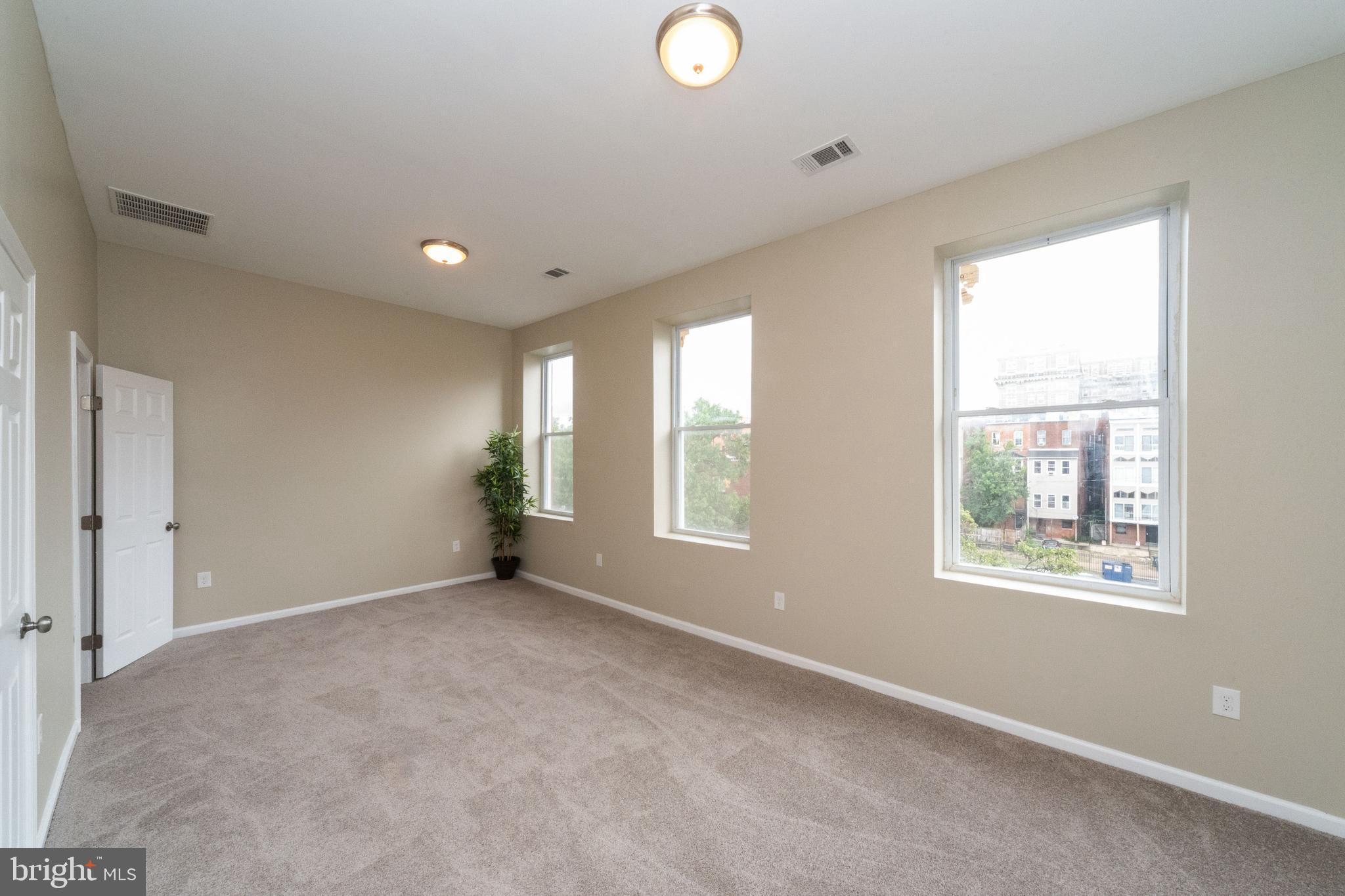 1708 Madison Avenue Baltimore, MD 21217 - Photo 45 of 56 a view of an empty room with a window