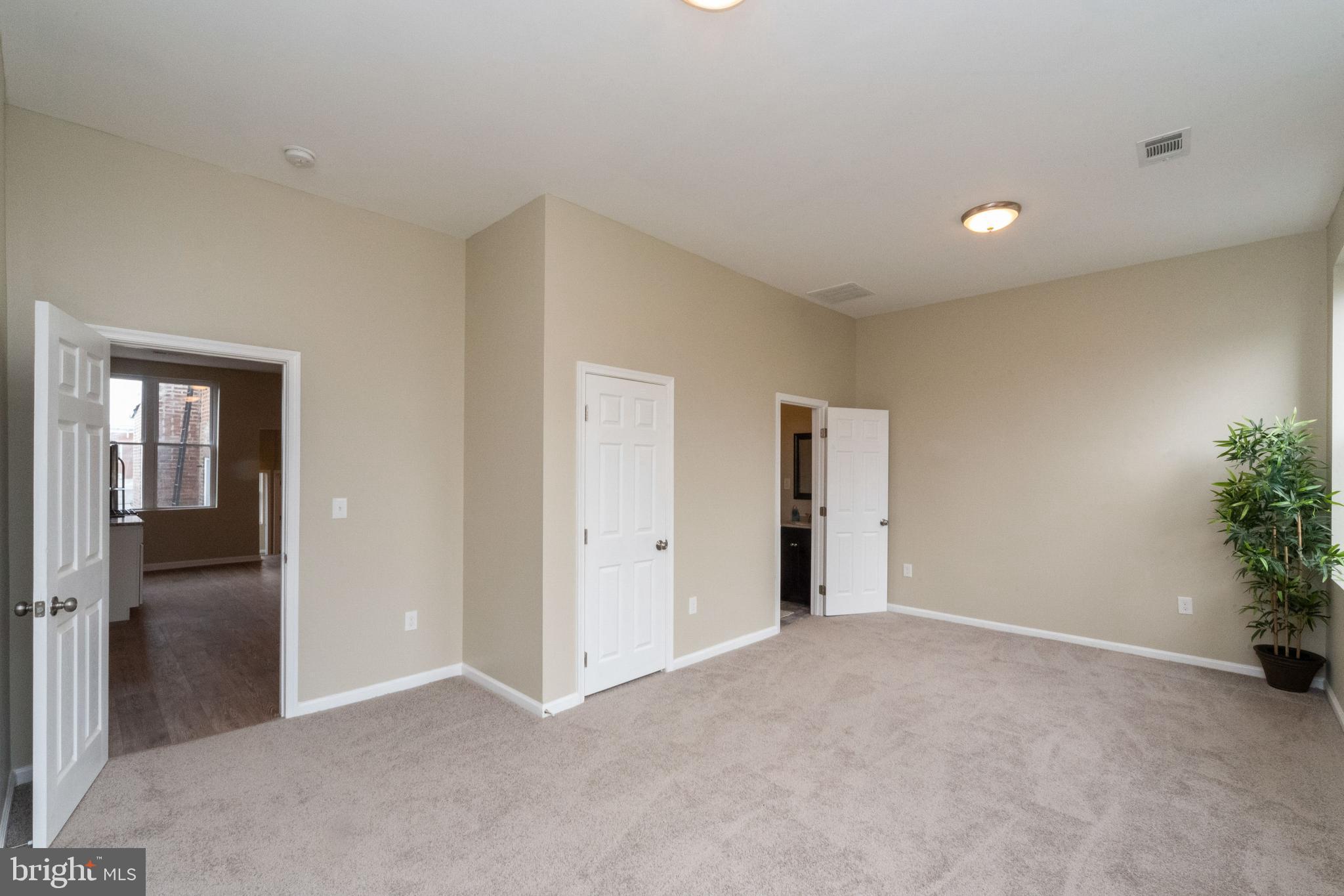 1708 Madison Avenue Baltimore, MD 21217 - Photo 46 of 56 an empty room with closet and entryway