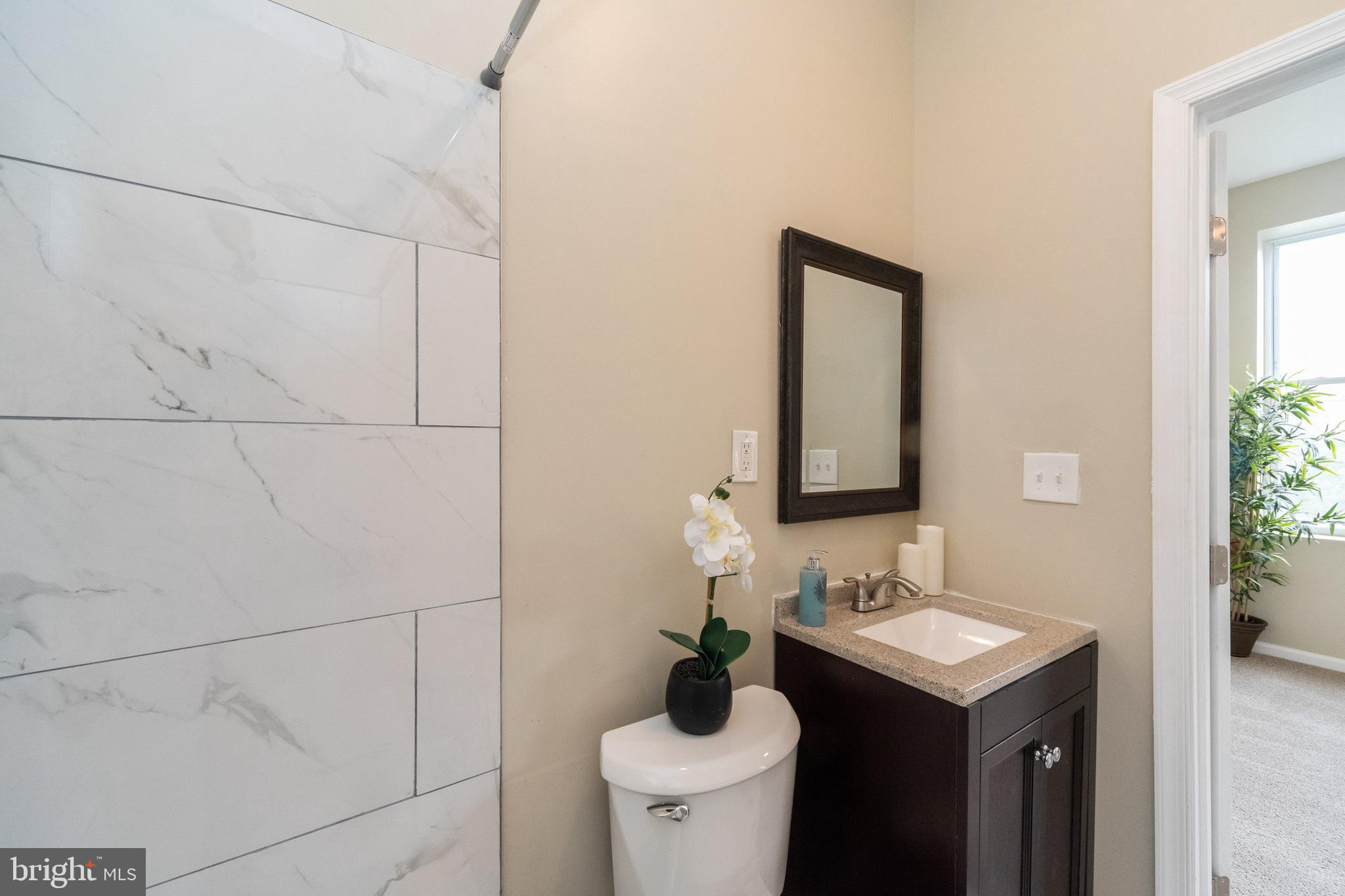 1708 Madison Avenue Baltimore, MD 21217 - Photo 50 of 56 a bathroom with a sink and a mirror