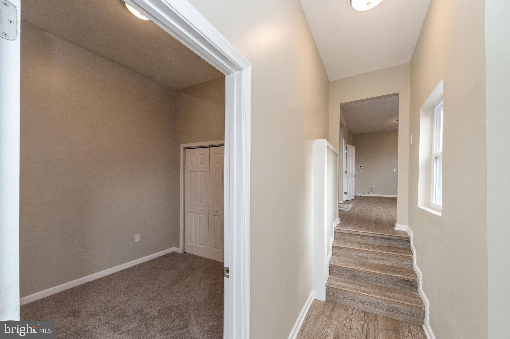 1708 Madison Avenue Baltimore, MD 21217 - Photo 51 of 56 a view of a hallway with wooden floor and entryway