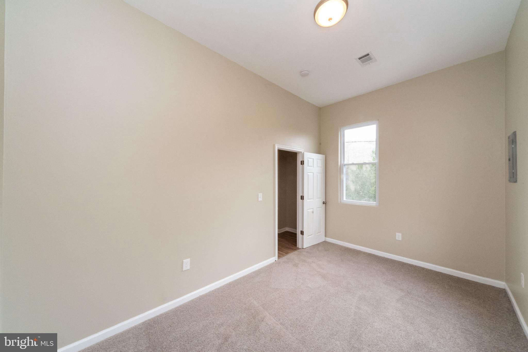 1708 Madison Avenue Baltimore, MD 21217 - Photo 55 of 56 a view of an empty room with a window