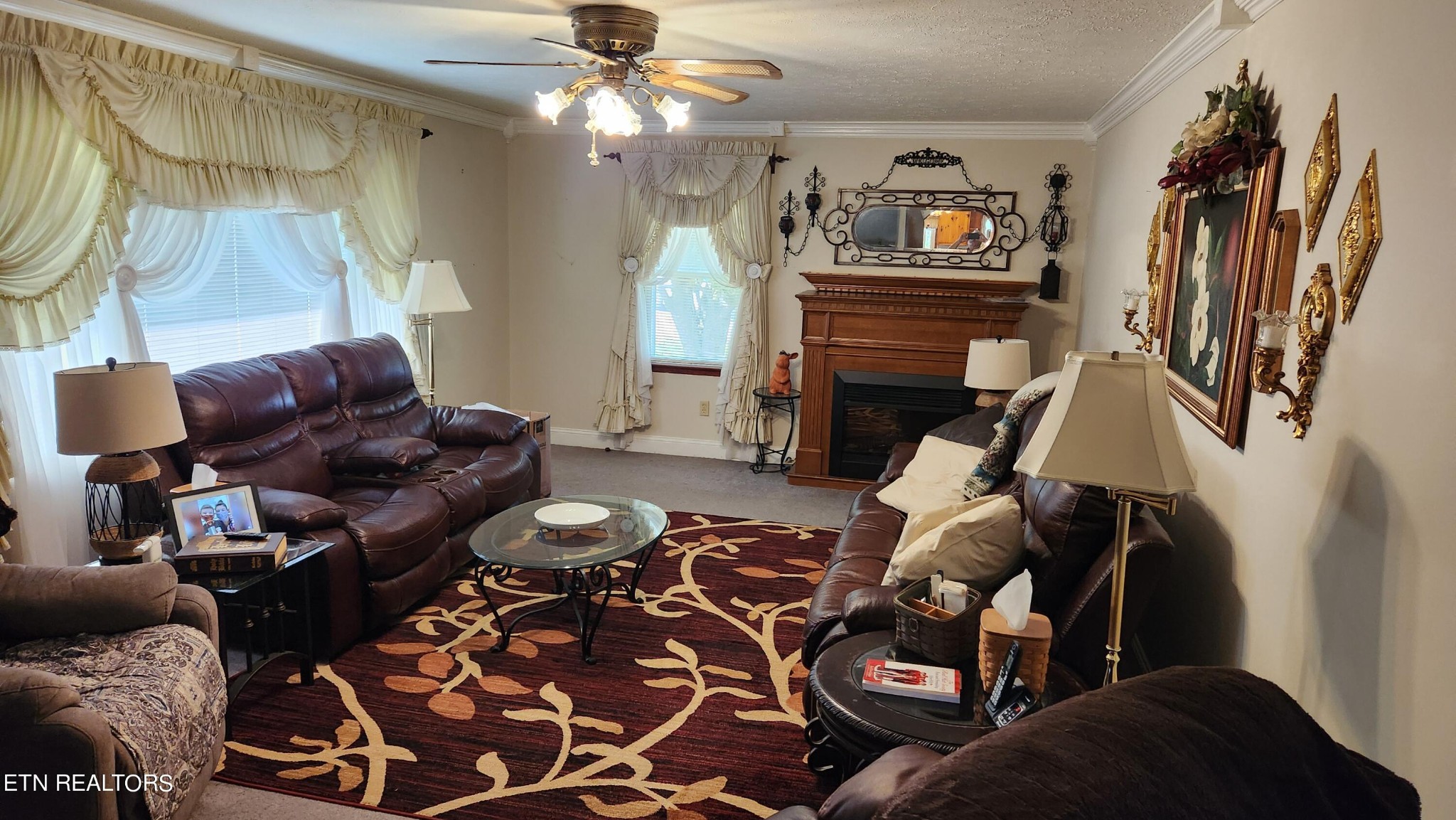 14915 Steekee Road Loudon, TN 37774 - Photo 17 of 37 a living room with furniture a fireplace and a flat screen tv