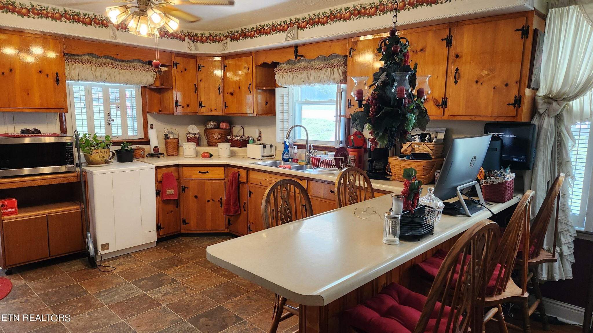 14915 Steekee Road Loudon, TN 37774 - Photo 21 of 37 a kitchen with sink a refrigerator and chairs