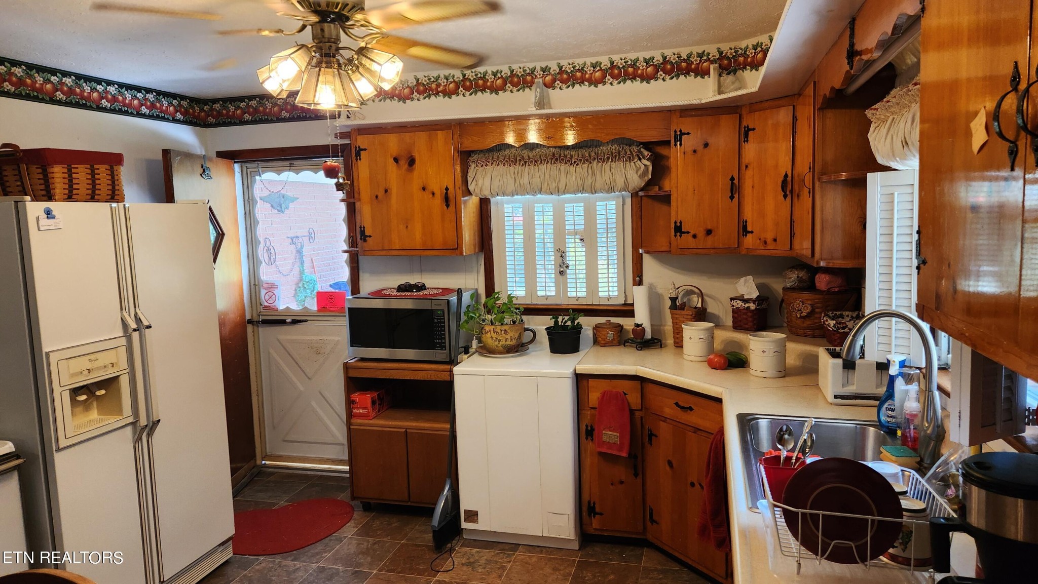 14915 Steekee Road Loudon, TN 37774 - Photo 23 of 37 a kitchen with stainless steel appliances a stove refrigerator and a sink
