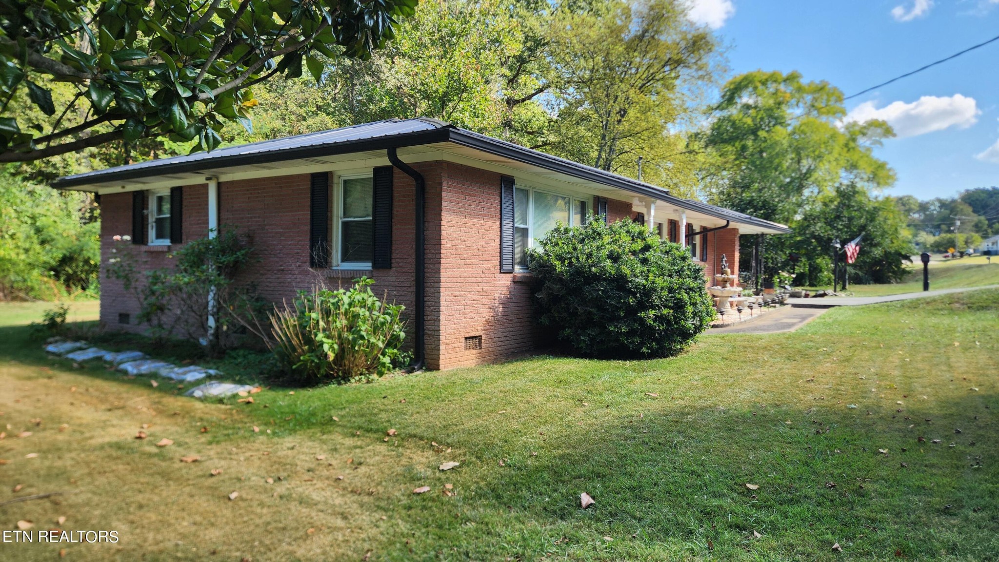 14915 Steekee Road Loudon, TN 37774 - Photo 3 of 37 a view of a house with yard and a garden