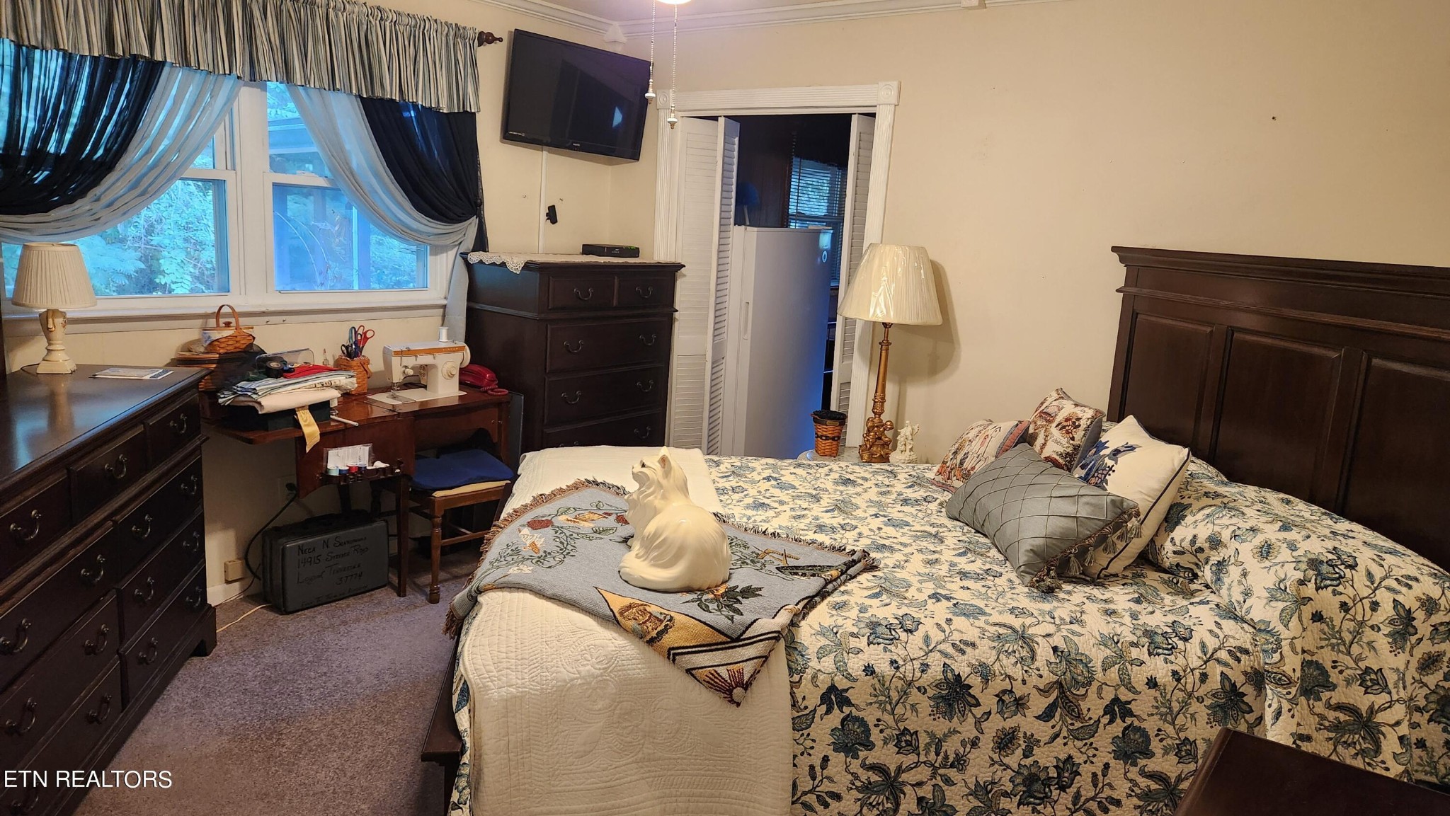 14915 Steekee Road Loudon, TN 37774 - Photo 34 of 37 a bedroom with a bed and flat screen tv