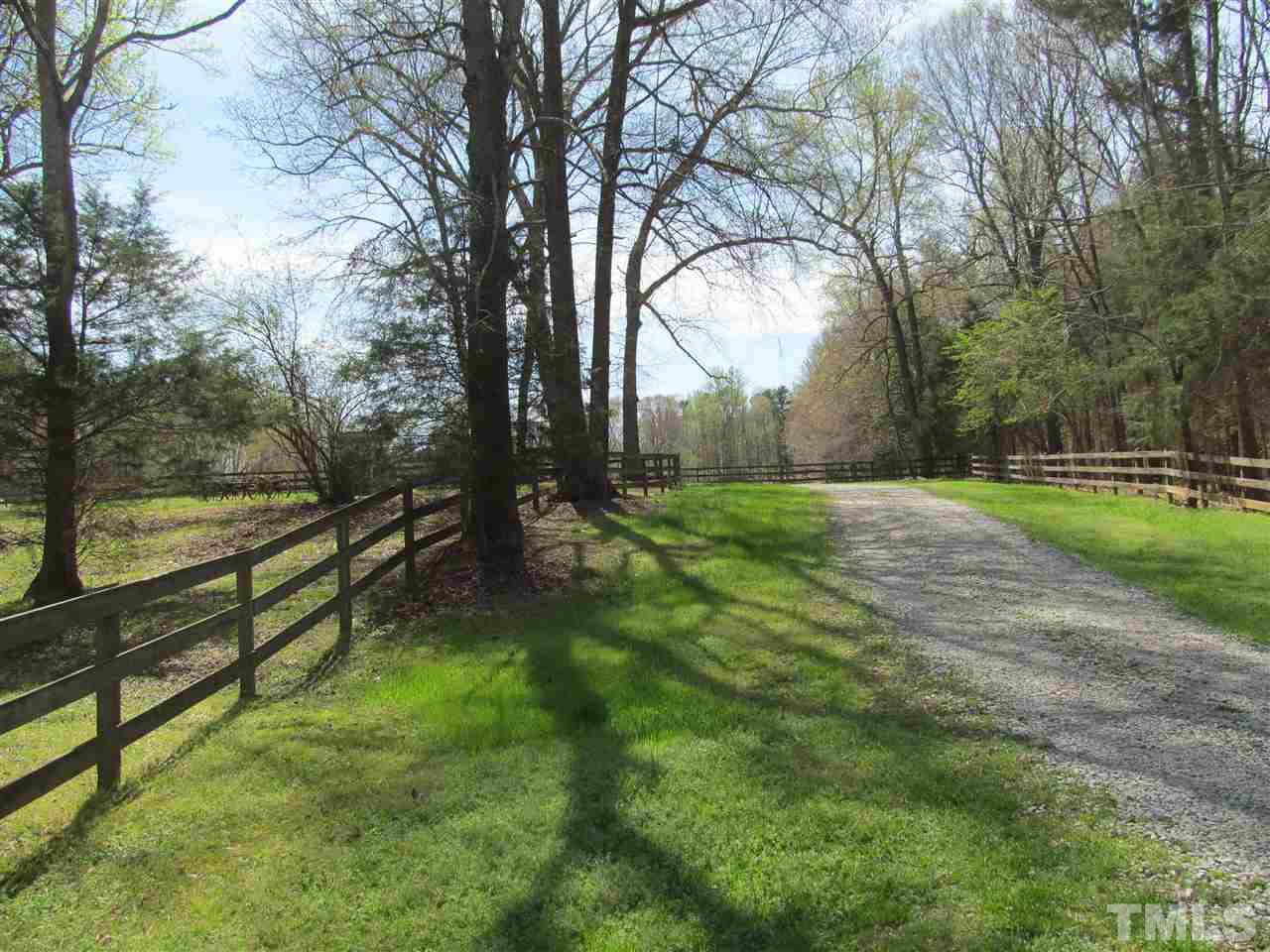 507 Mason Road Durham, NC 27712 - Photo 1 of 20 a view of outdoor space with deck and trees