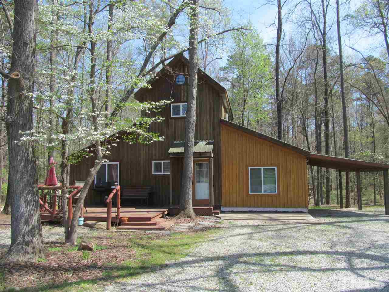 507 Mason Road Durham, NC 27712 - Photo 12 of 20 a view of a house with backyard and trees