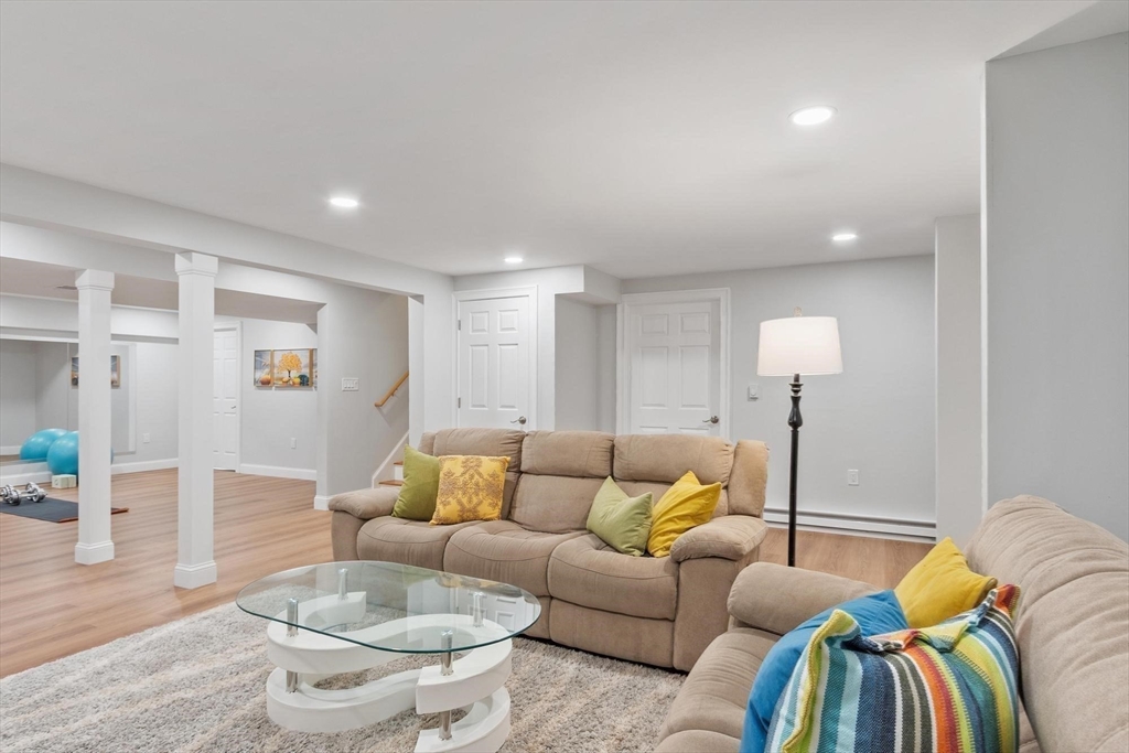 56 Old Marlboro Road Concord, MA 01742 - Photo 20 of 34 a living room with furniture and a wooden floor
