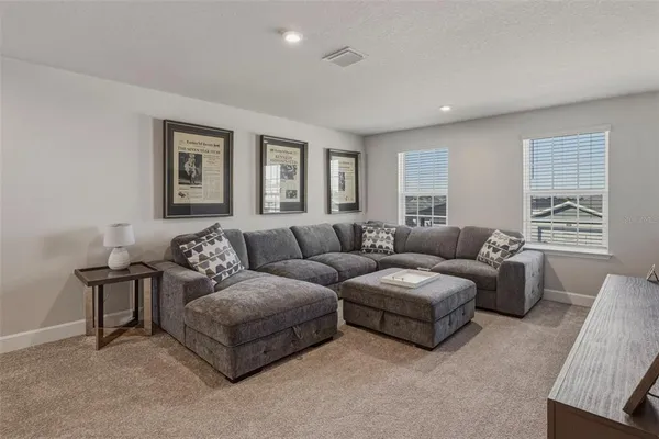 a living room with furniture and a window