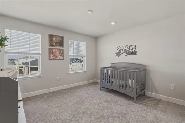 a bedroom with furniture and window