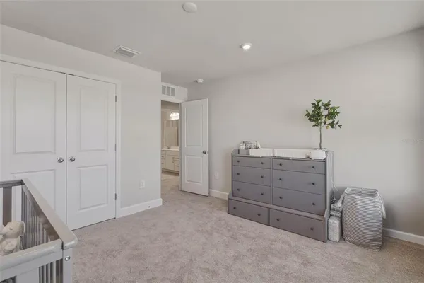 a view of a bedroom with cabinet