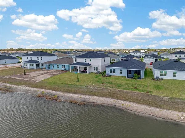a view of a big house with a big yard
