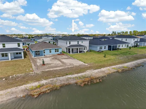 a view of a lake with a big yard