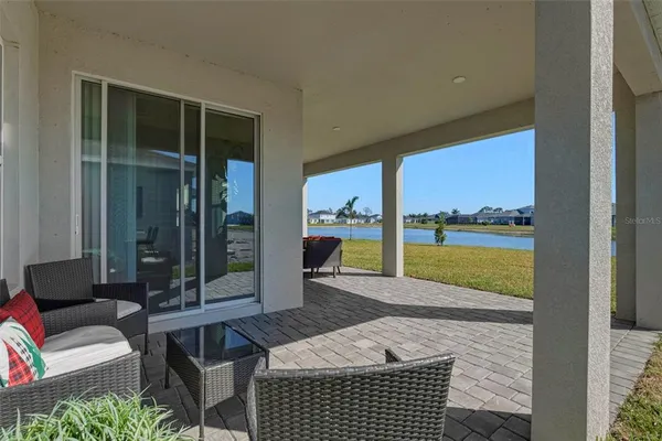 a view of balcony with furniture and garden