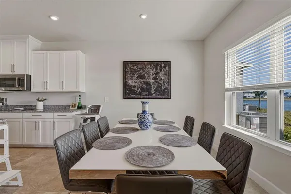a view of a dining room with furniture window and outside view