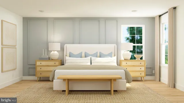 a bedroom with a large bed and a window