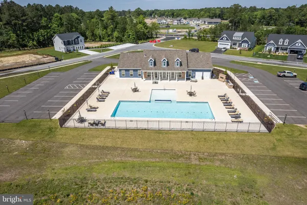 a view of a swimming pool with a lake view