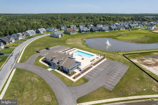 a view of a swimming pool with a yard