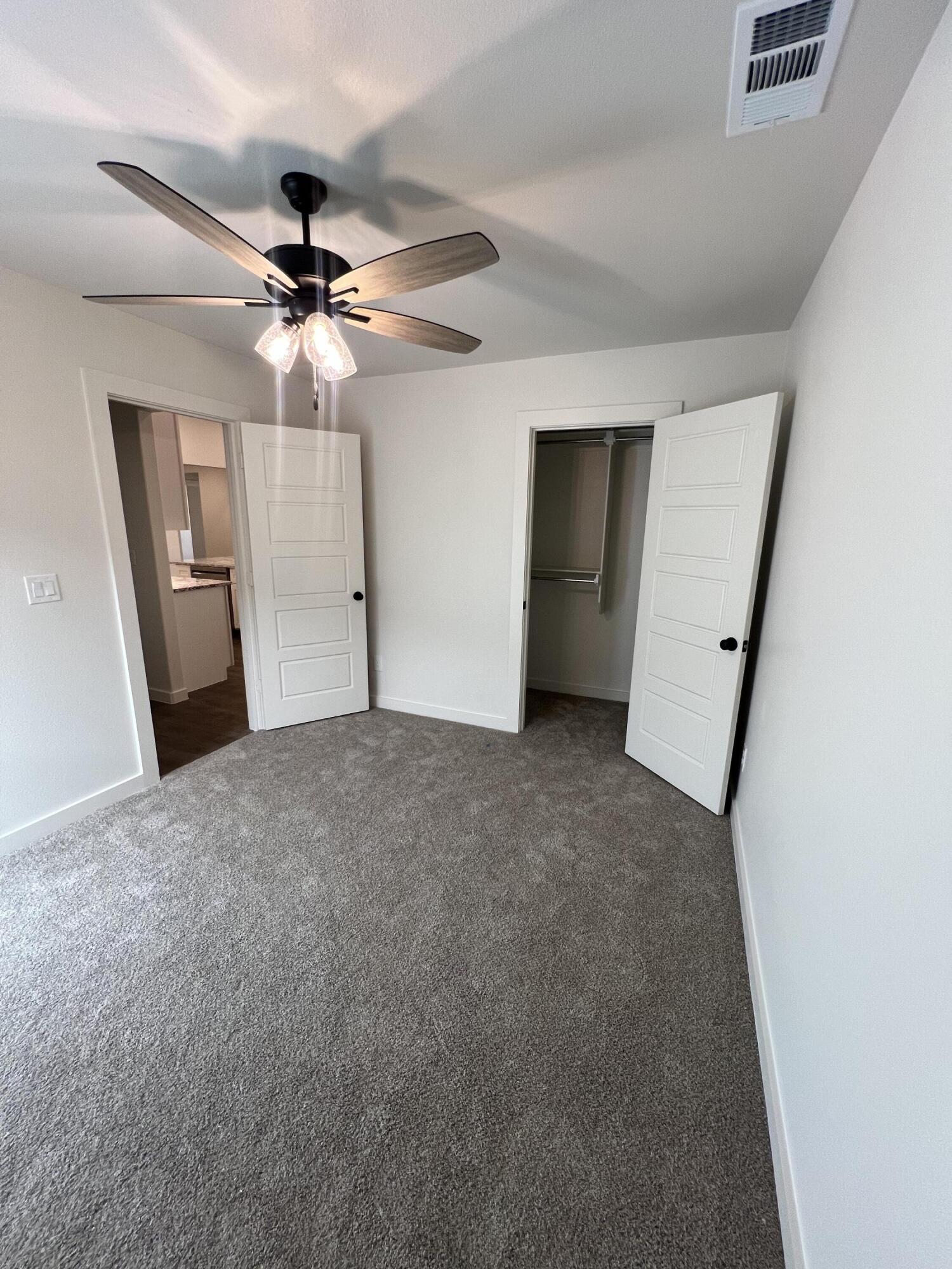 3105 140th Street Lubbock, TX 79423 - Photo 12 of 23 a view of a livingroom with a ceiling fan and window