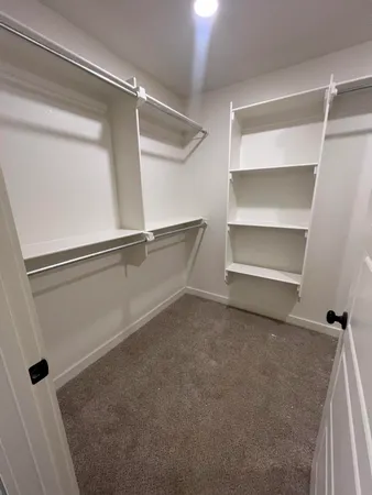 a view of an empty walk in closet