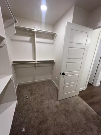 a view of an empty walk in closet