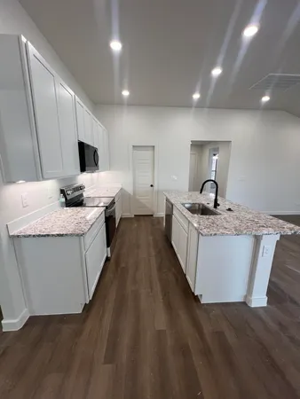 a living room with granite countertop furniture and a couch