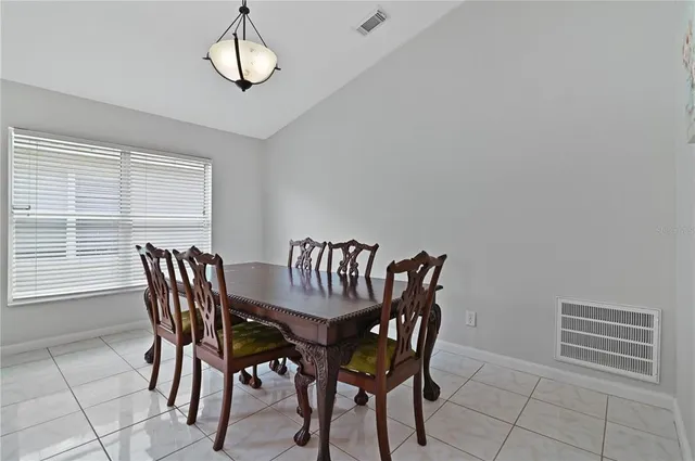 a view of a dining room with furniture