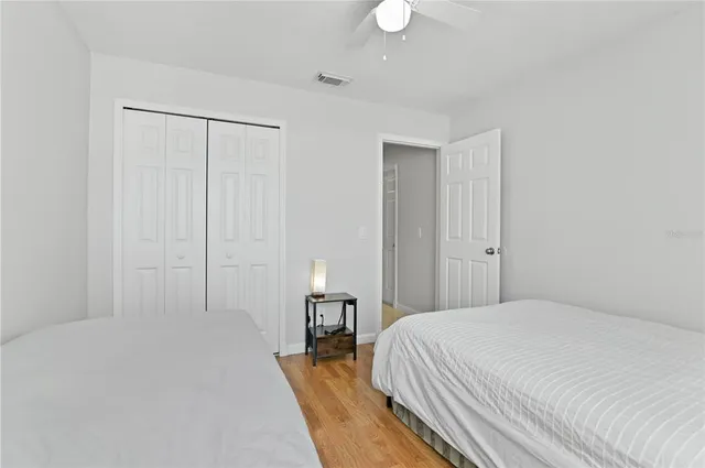 a bedroom with a bed and a table