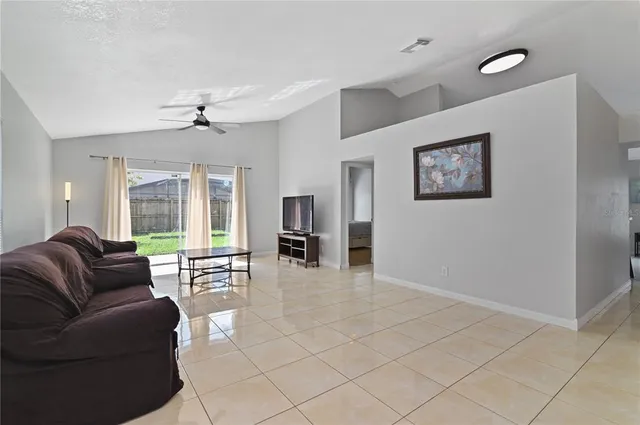 a living room with furniture and window