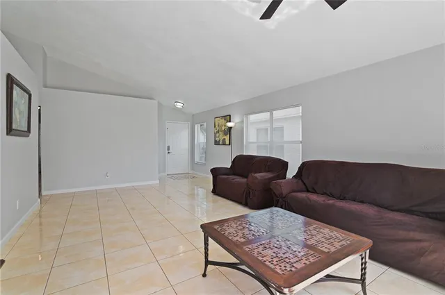 a living room with furniture and a rug