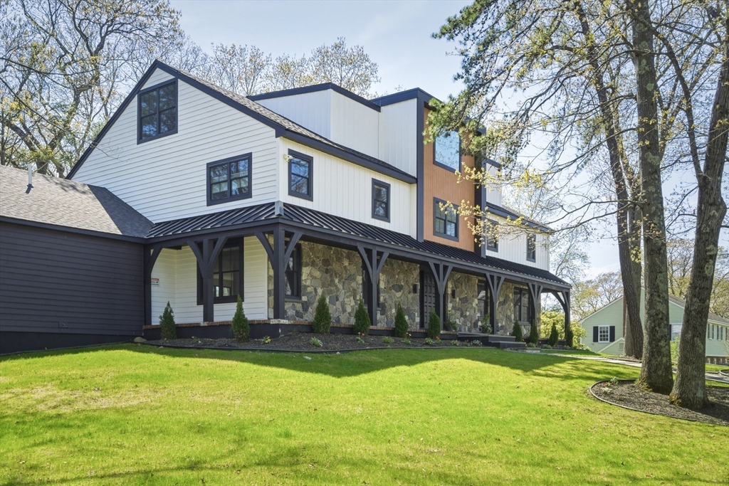 70 Birch Hill Road Belmont, MA 02478 - Photo 1 of 41 a front view of a house with a yard