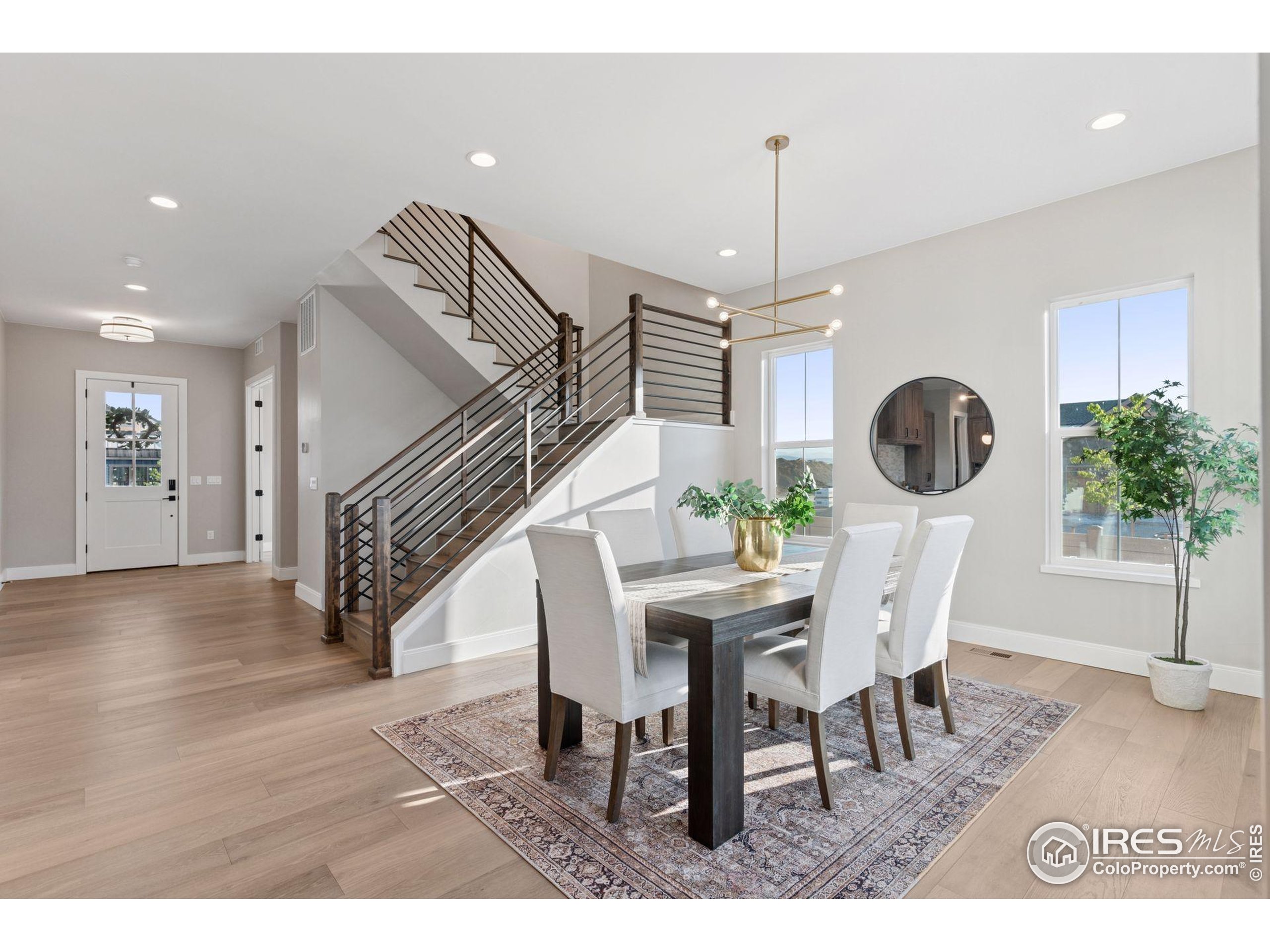927 William Way Berthoud, CO 80513 - Photo 12 of 28 a view of a dining room with furniture and wooden floor