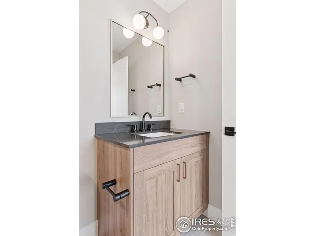 a bathroom with a sink a double vanity and a mirror
