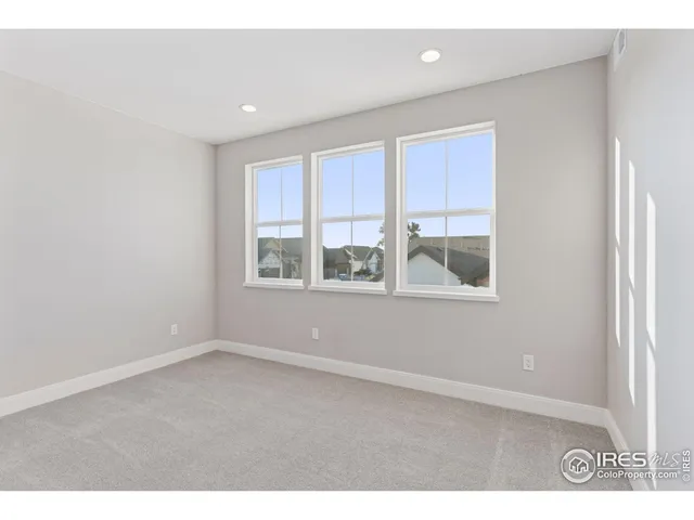 a kitchen with stainless steel appliances kitchen island granite countertop a table and chairs in it
