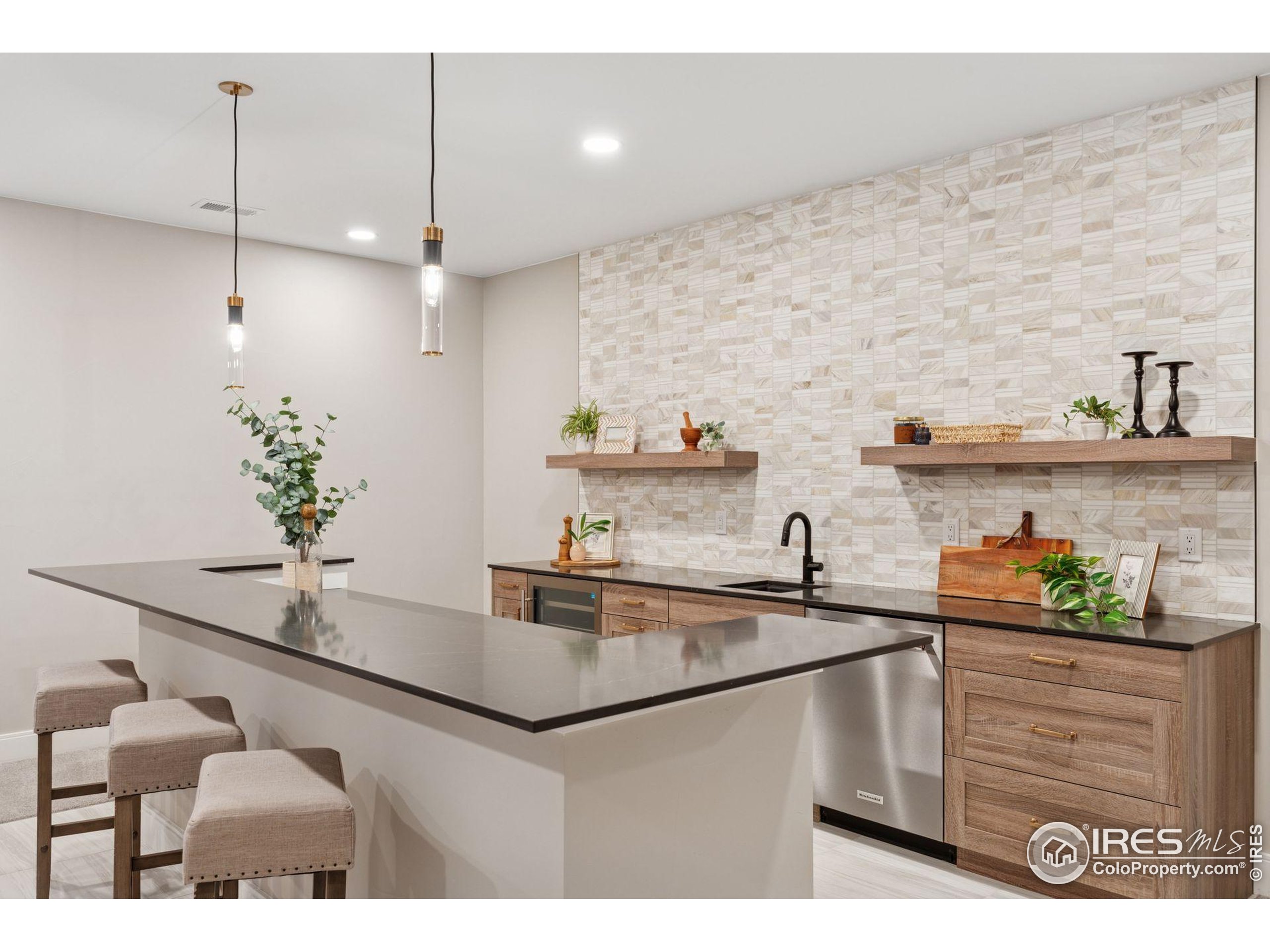 927 William Way Berthoud, CO 80513 - Photo 23 of 28 a kitchen with a sink a counter space and cabinets