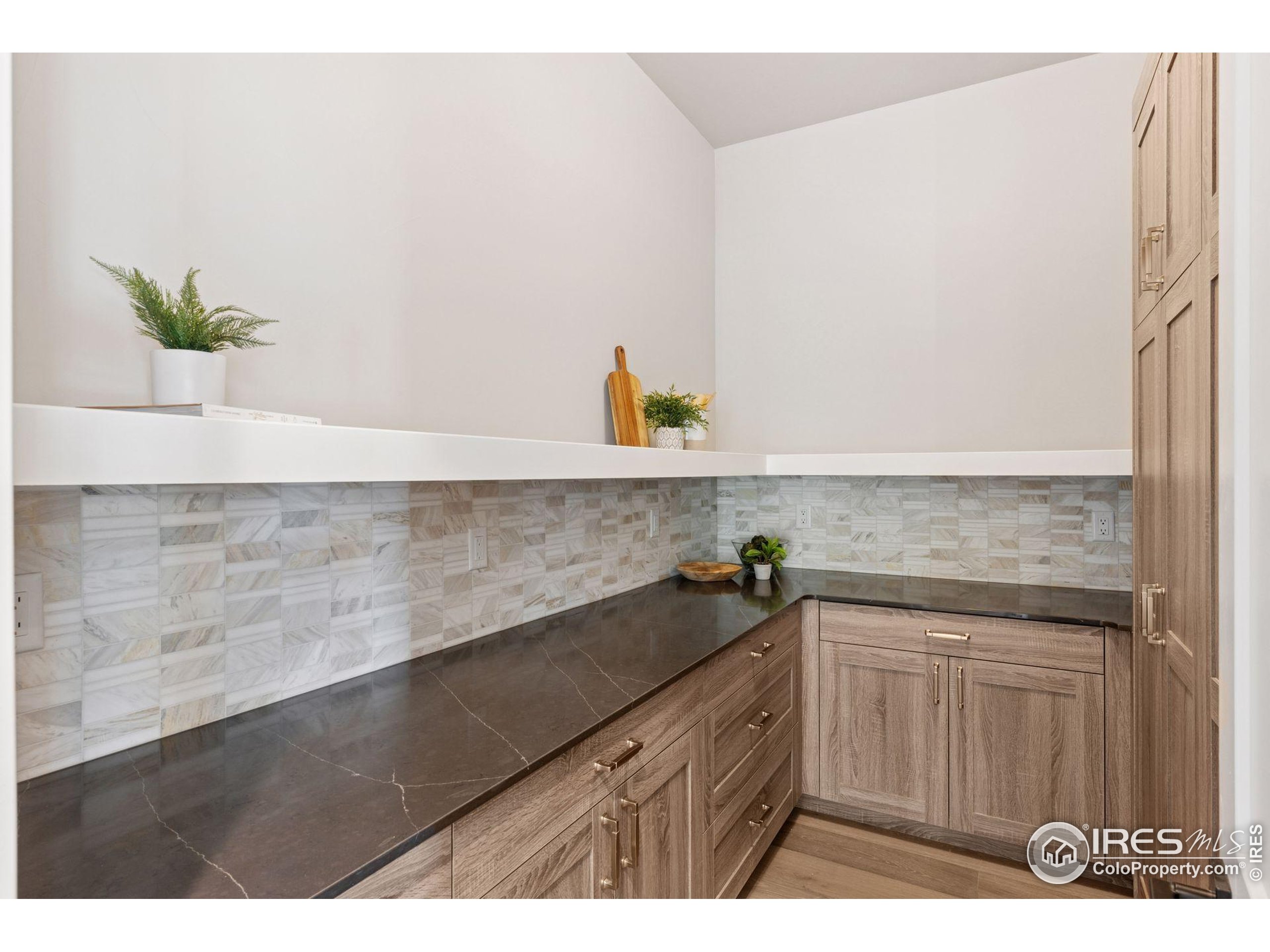 927 William Way Berthoud, CO 80513 - Photo 6 of 28 a kitchen with a sink and cabinets